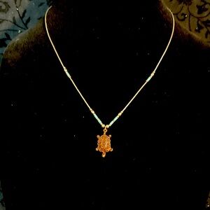 Gold Turtle Pendant Necklace with Blue Accents